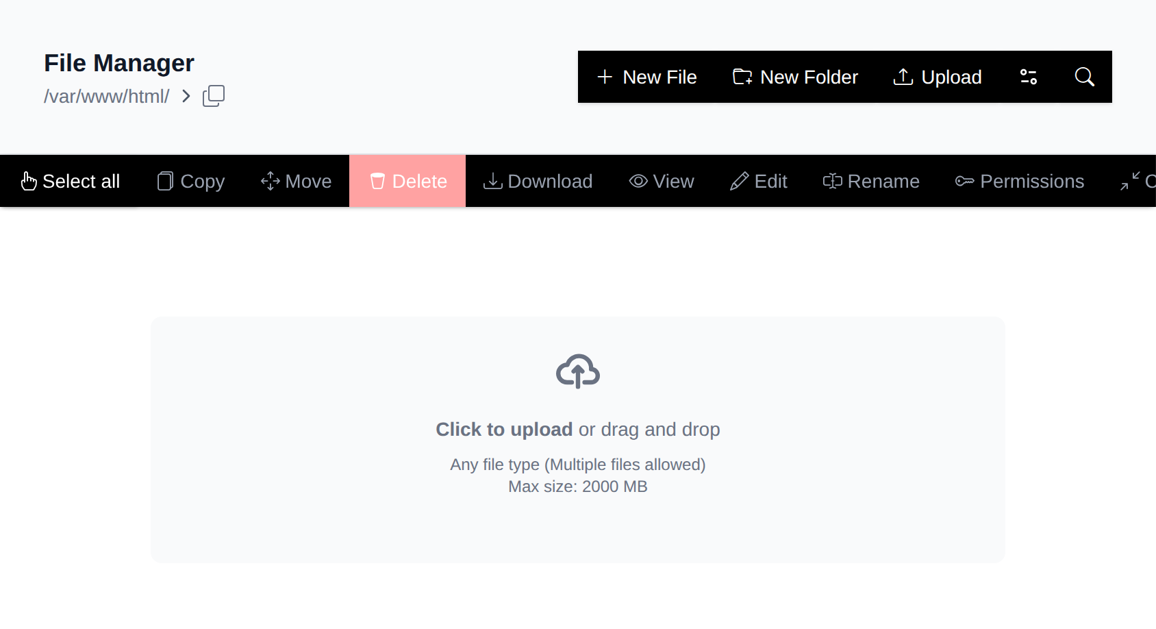 File Manager while dragging files over the page, with the drag and drop upload area shown above the file list