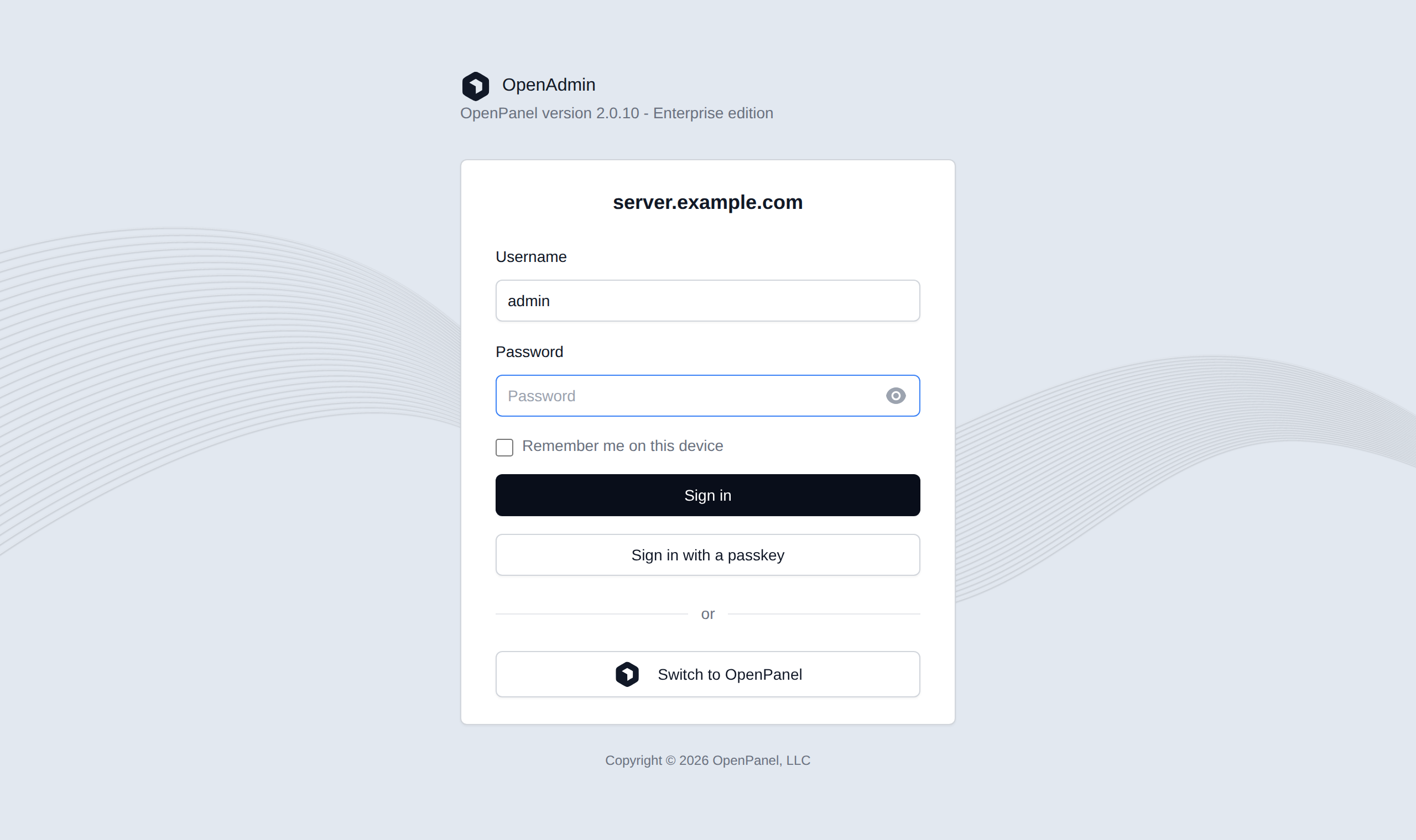 OpenAdmin login form with the username and password fields, Remember me, passkey sign-in and the Switch to OpenPanel button