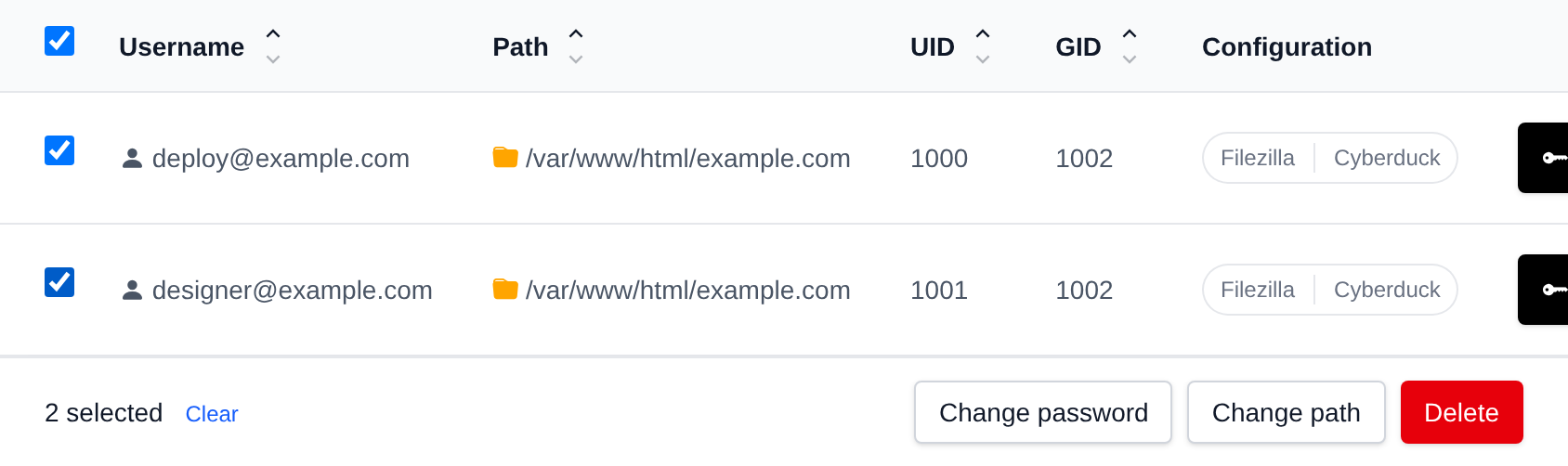 Two FTP accounts selected with the bulk actions bar offering Change password, Change path and Delete
