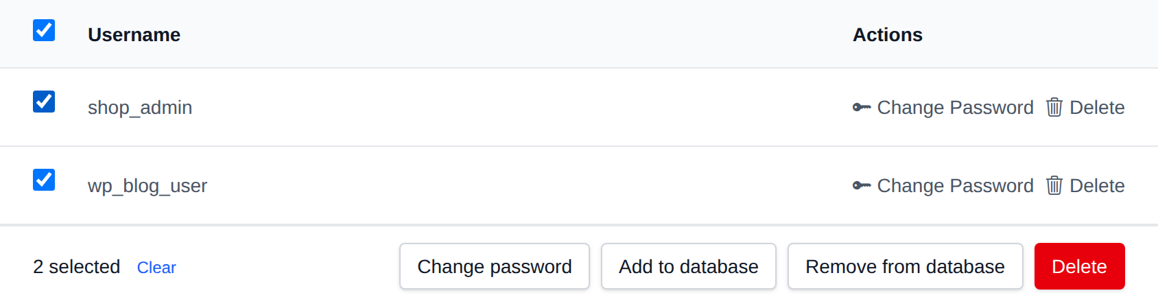 Two PostgreSQL users selected with the bulk actions bar offering Change password, Add to database, Remove from database and Delete